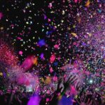 At a concert, many people throw up paper glitter to celebrate and have fun.